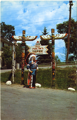 Chief Poolaw Statue with Totems