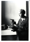 Dr. Edith Patch at a Microscope