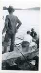 Men on Dock Preparing Fish