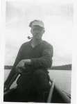 Joseph Giguere in a Boat with Pipe