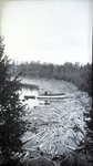Boat, Wood Floating in Water Near Shore (Untitled) by Bert Call