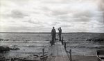Men on Pier at Shore by Bert Call