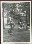 Man Rides Unicycle Through Park by Franco-American Programs, Orono, ME