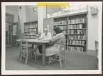 Man and Woman Sitting at Table, Manchester NH by Franco-American Programs, Orono, ME