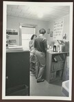 Daniel Parent and Woman talking in Record Room by Franco-American Programs, Orono, ME