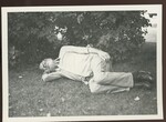 Man Lays on Grass at Lewiston Franco American Festival by Franco-American Programs, Orono, ME